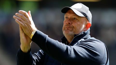 Bromley boss Andy Woodman applauds the club's fans