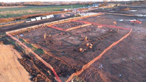 An aerial view of an area being excavated by archaeologists