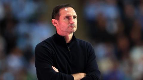 Frank Lampard watching Coventry with his arms folded