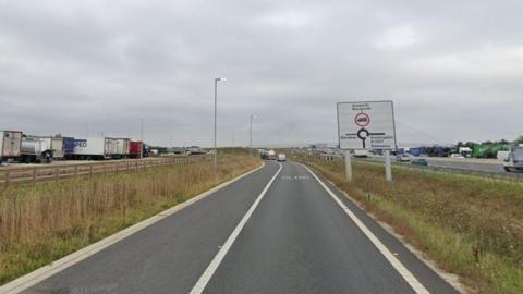 Two-lane slip road showing A1307 roadsign