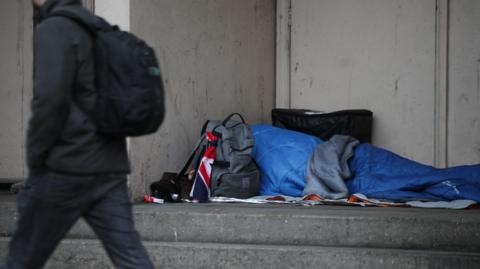 A file photo dated 07/02/17 of a homeless person sleeping rough in a doorway.