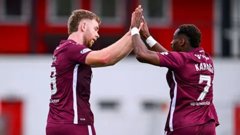 Stuart Findlay (left) opened the scoring for Hearts