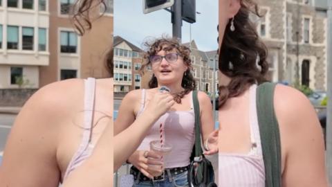 Young woman wearing glasses and a pink top.