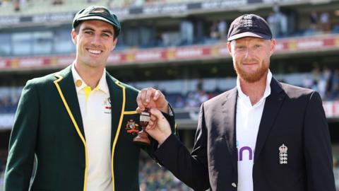 Pat Cummins and Ben Stokes with the Ashes urn