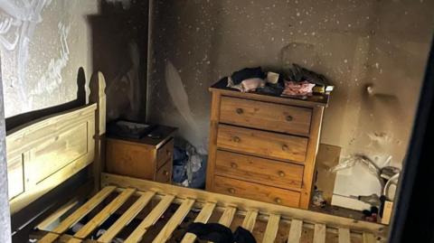 The smoke-damaged bedroom