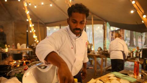 Brin Pirathapan wearing a apron while cooking