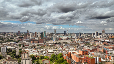 Aerial view of Birmingham city centre taken in 2024. Tower blocks and cranes dominate the skyline.