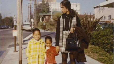 A young Kamala Harris with her sister and mother