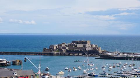 A shot of Guernsey's Castle Cornet on a sunny day with the marina in view