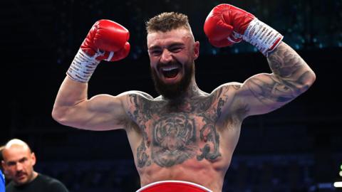 Lewis Crocker poses with his belt after beating Paddy Donovan 