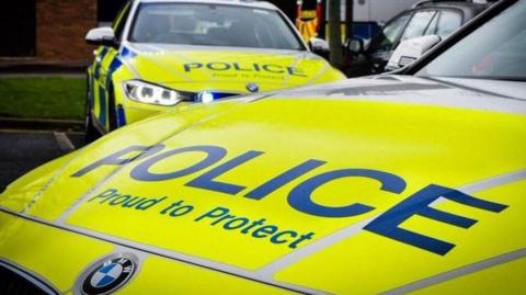 Bonnet of Northumbria Police car, in front of another police car