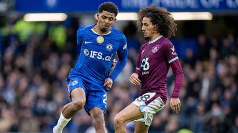 Wesley Fofana and Hannibal Mejbri compete for the ball during the Premier League match between Chelsea and Burnley at Stamford Bridge