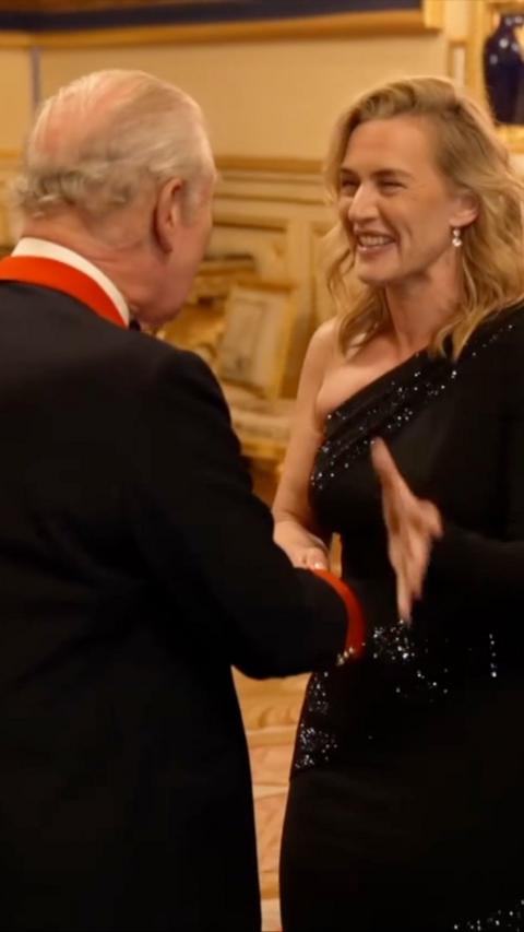 King Charles hugging Kate Winslet