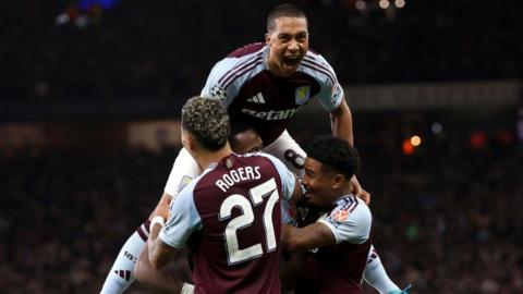 Aston Villa celebrate scoring against Bayern Munich in the Champions League