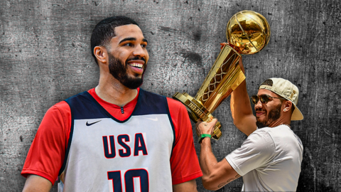 Jayson Tatum smiling and celebrating with the NBA trophy