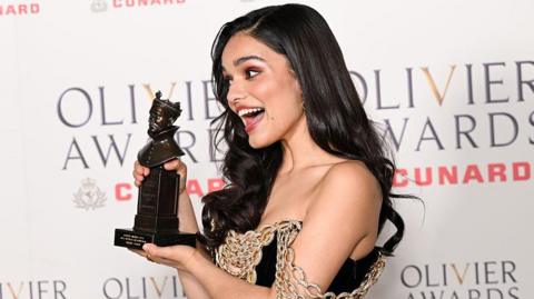 Picture of Rachel Zegler holding her Olivier award