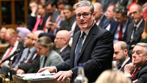 Sir Keir Starmer standing and speaking at Prime Minister's Question time in the House of Commons today