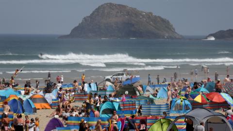 People on Perranporth beach in the summer