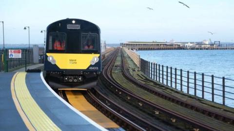 Island Line train running along the pier