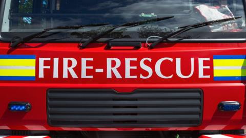 A close-up shot of a red fire engine. 