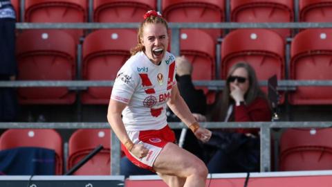 St Helens winger Dani McGifford celebrates scoring a try.
