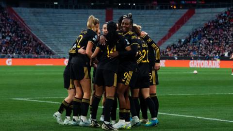 Malard celebrates with Manchester Utd team mates
