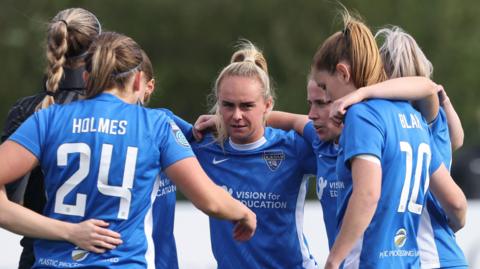 Durham Women players in a huddle before a match against Birmingham City