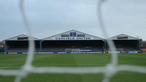 A view of the Warwick Road End through the nets at Carlisle United's Brunton Park ground 