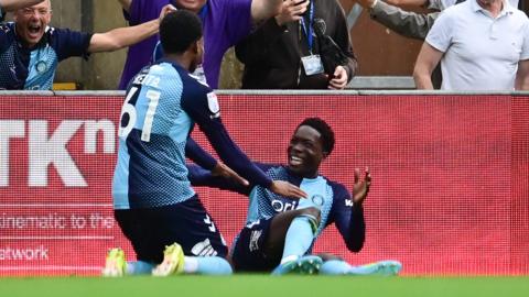 Micah Olabiyi celebrates scoring for Wycombe against Rotherham