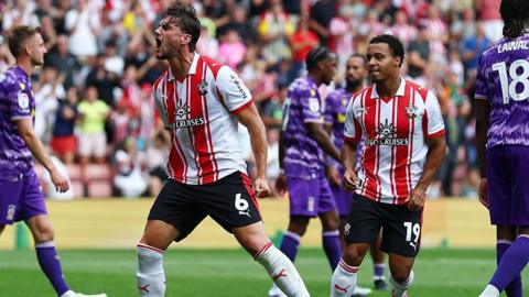 Taylor Harwood-Bellis celebrates after Southampton score a goal in the EFL Championship