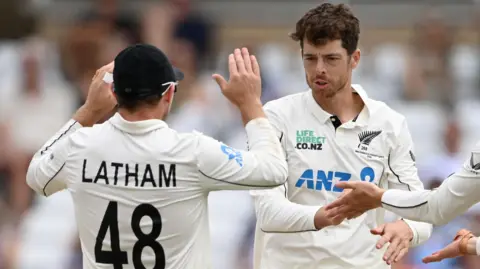 New Zealand players celebrate a wicket