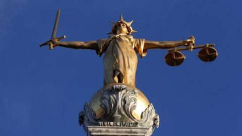 FW Pomeroy's Statue of Justice on top of the Central Criminal Court building, Old Bailey, London. 