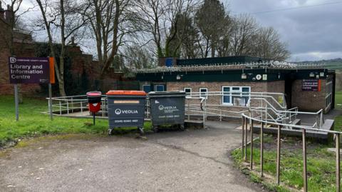 Concrete building with metal railings in front