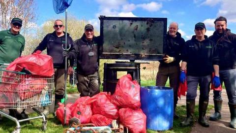 Volunteers with Litter picked items 