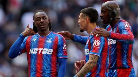 Eberechi Eze of Crystal Palace celebrates scoring against Tottenham with teammates Daniel Munoz and Jean-Philippe Mateta.