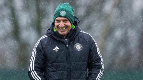 Brendan Rodgers smiles at training