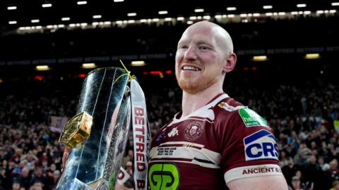 Liam Farrell holding the Super League trophy at Old Trafford in October 2024 