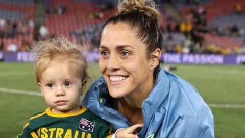 West Ham midfielder Katrina Gorry and her daughter Harper