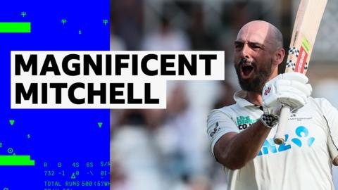 Daryl Mitchell waves his bat around to celebrate hitting a century on day four of England v New Zealand's Test match series