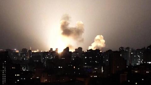 Ukraine skyline at night lit up by a missile