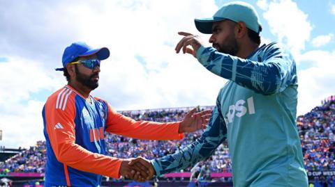 India's Rohit Sharma shakes Pakistan's Babar Azam's hand