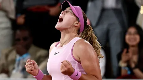 Mirra Andreeva celebrates