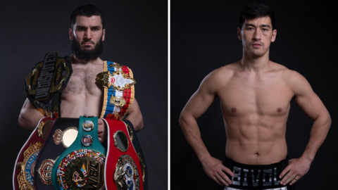 Artur Beterbiev poses with his world titles and Dmitry Bivol puts his hands on his hips