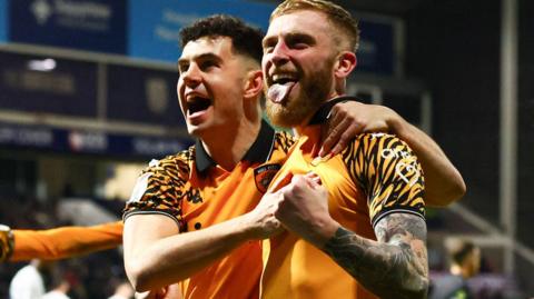 Oli McBurnie (right) celebrates his 10th Championship goal of the season