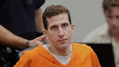 Bryan Kohberger, 30, appears for his sentencing hearing dressed in an orange jump suit with no expression