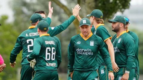 Guernsey cricketers celebrate a wicket