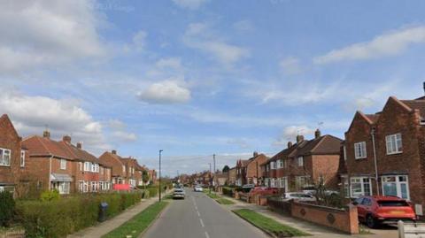 A street lined with houses on either side.