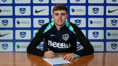 Portsmouth defender Zak Swanson signs his new Pompey deal.