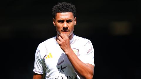 Ollie Watkins warms up