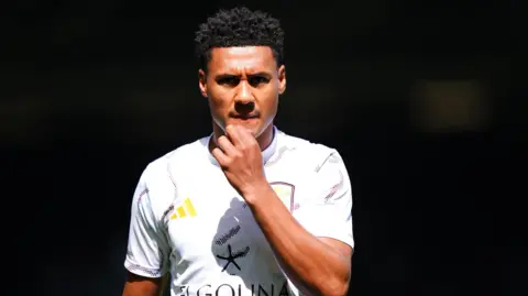 Ollie Watkins warms up